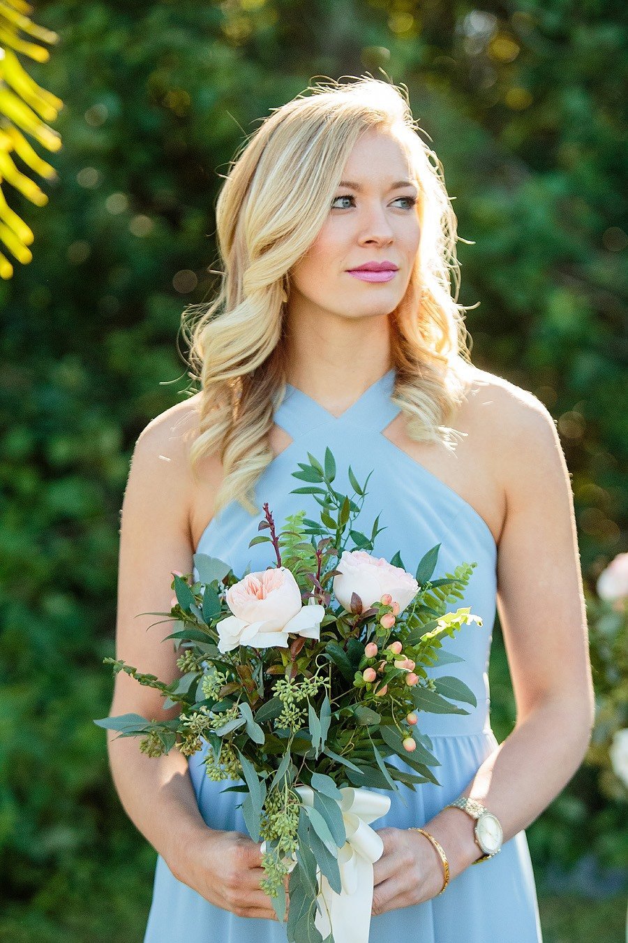 blue bridesmaid dress with bouquet