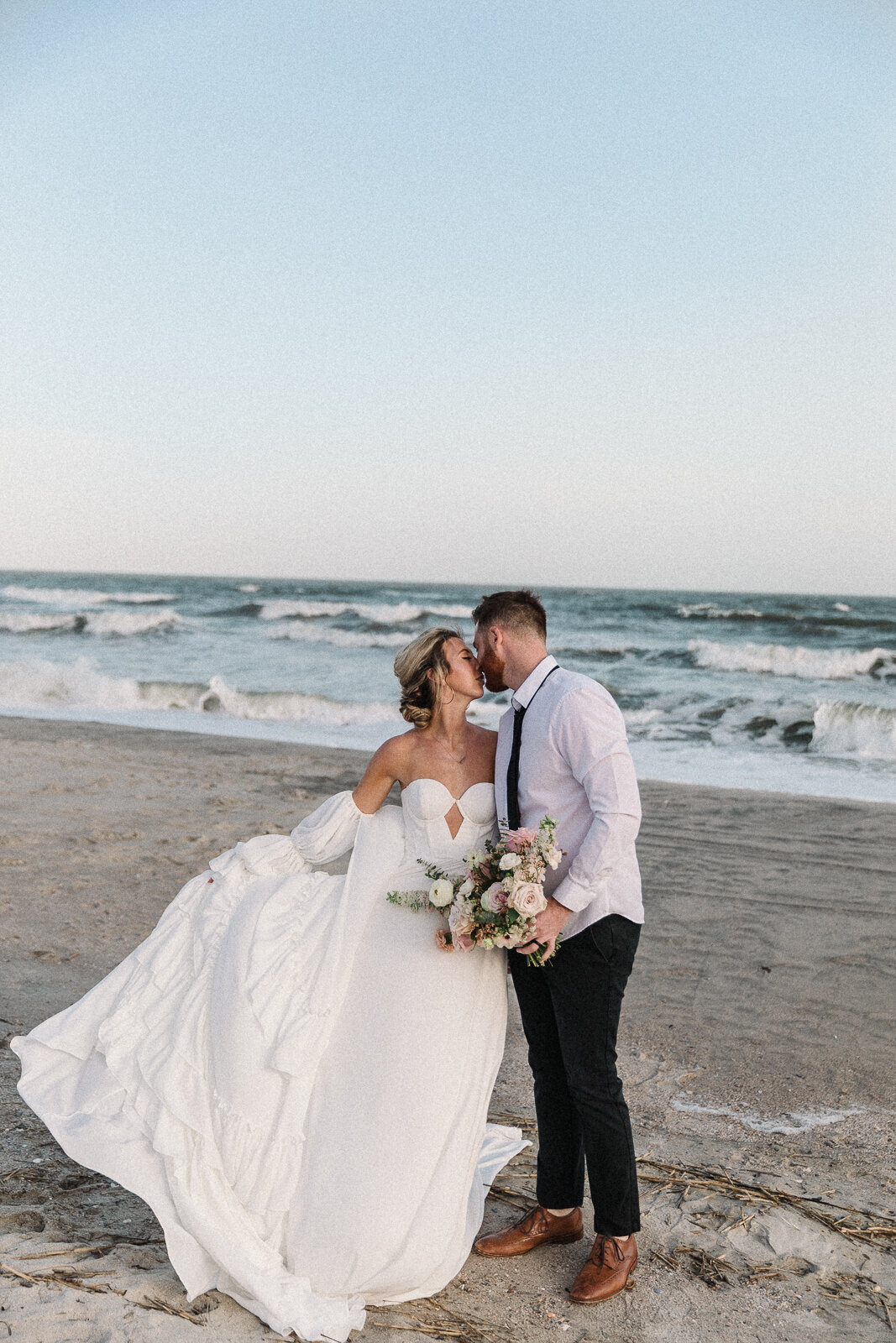 bride flowing her dress on croatia beach after eloping in croatia
