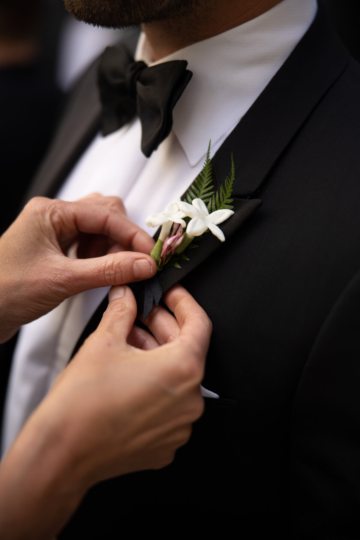 Boutonniere on groom's tux NYC wedding