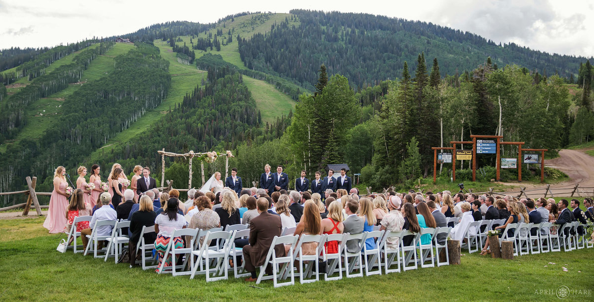 Beautiful Outdoor Wedding on Mt. Werner  with ski slope backdrop during summer in Steamboat Springs Colorado