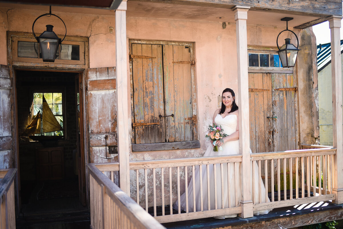 Beautiful wedding photography: Bride on the balcony at Race & Religious in New Orleans, NOLA Wedding