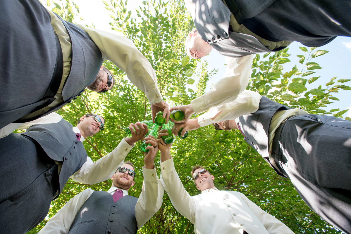 groomsmen cheering outside at Willow Creek Golf and Country Club wedding photo