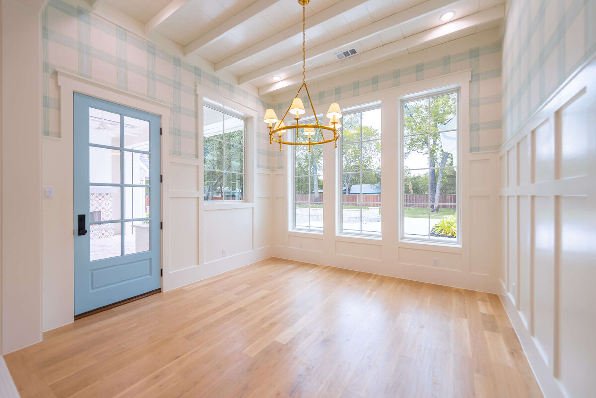 Custom home near Colleyville, Texas with wallpaper and light blue door