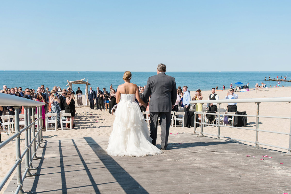 photo of dad walking bride down the aisle for beach ceremony wedding at Pavilion at Sunken Meadow