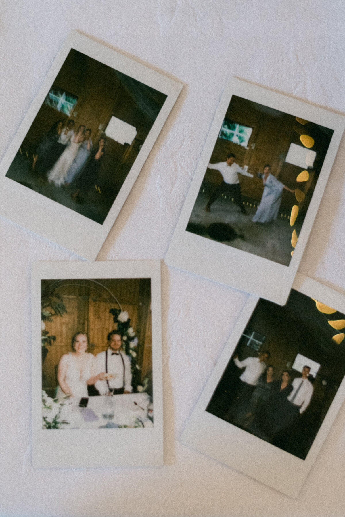 Polaroids on a table in an image captured by wedding photographer Hannika Gabrielsson.