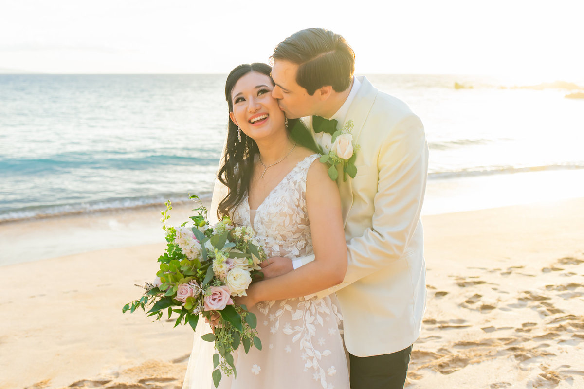 Hawaii wedding photography - bride and groom kissing