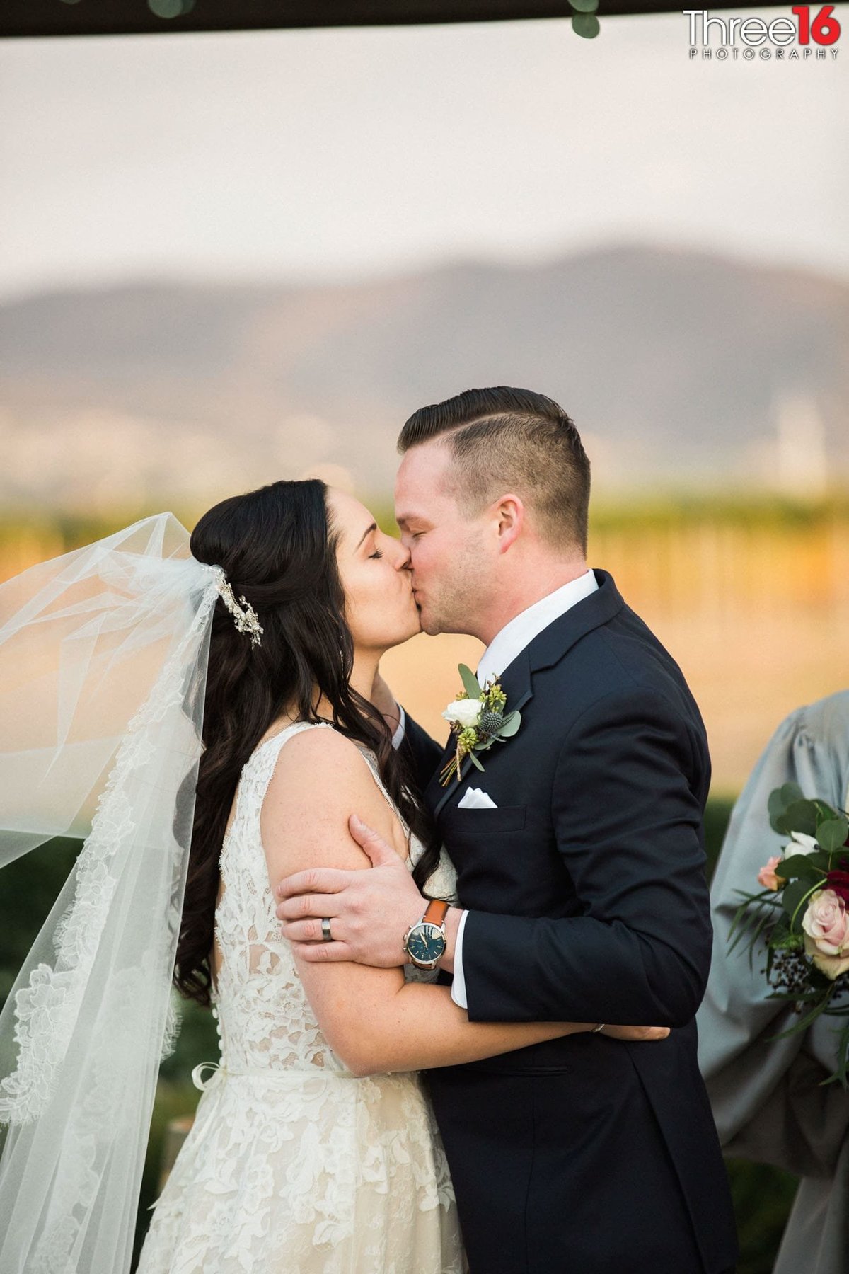 Groom kisses his Bride to seal the deal