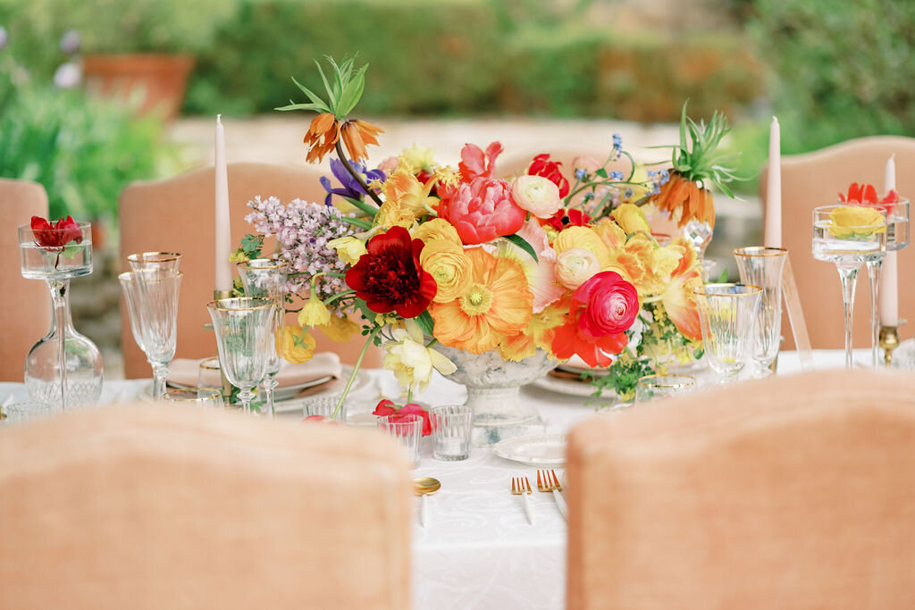 a colorfull centerpiece on a wedding table