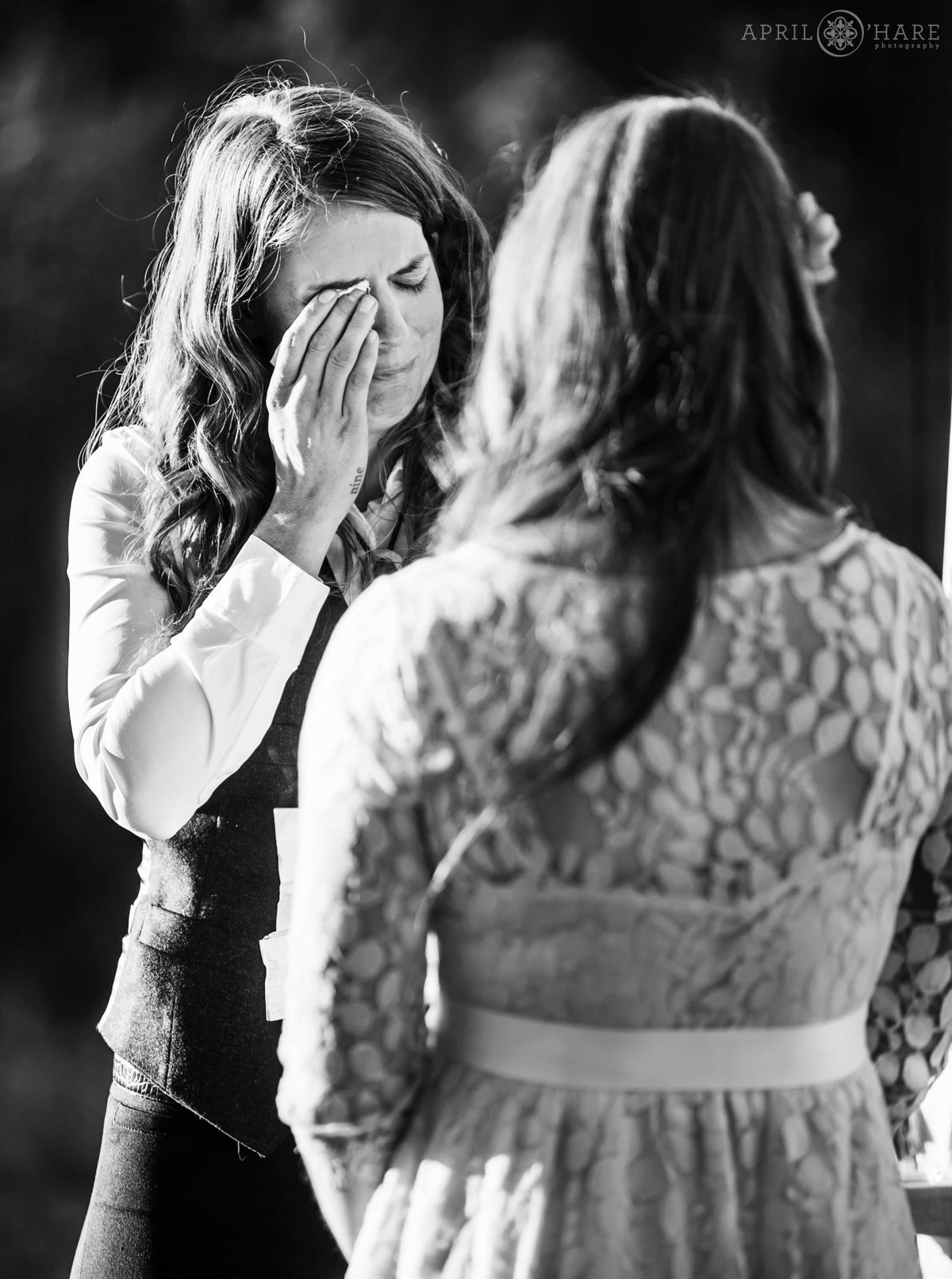 Bride cries during her wedding ceremony in Conifer Colorado