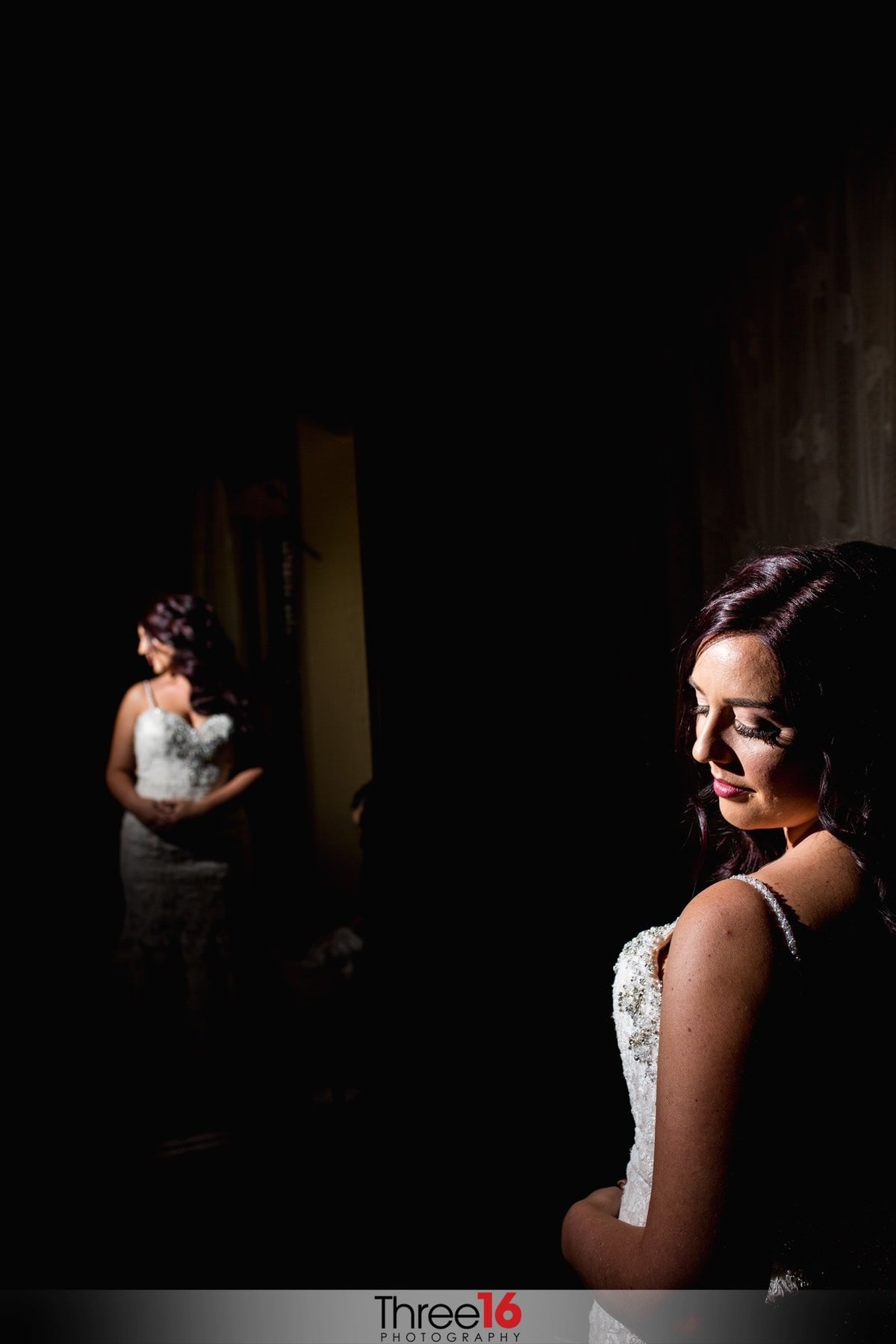 Bride spends a tender moment alone reflecting before her special day