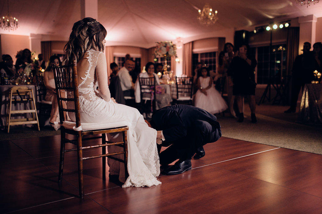 Wedding Photograph Of Bride Looking At Her Groom Kneeling In Front Los Angeles