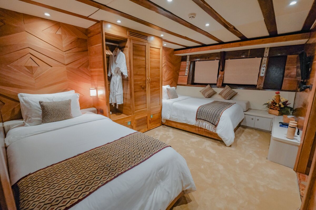 Twin cabin perfect for families onboard the contemporary yacht Lamima in Indonesia.