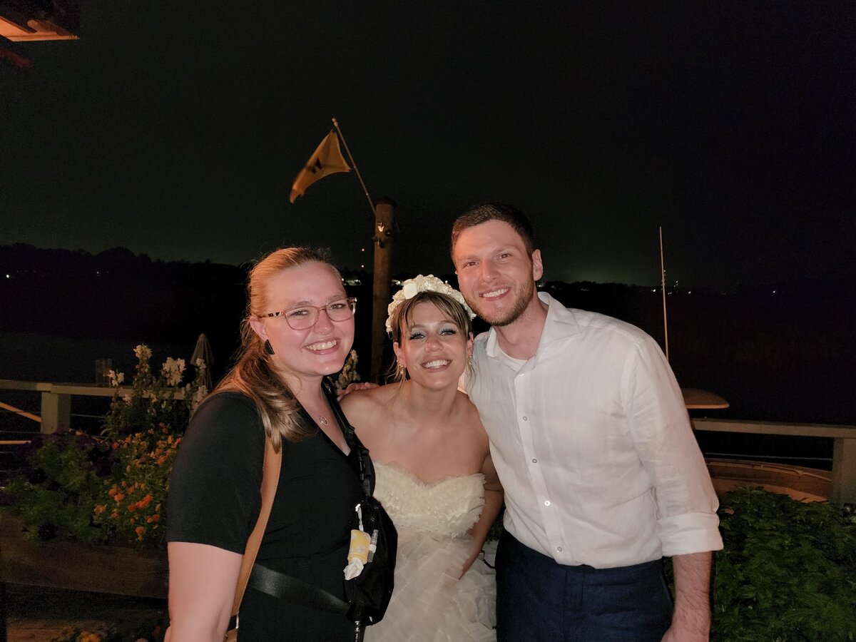 Savannah Wedding Photographer with couple at wedding reception on wild dock bar