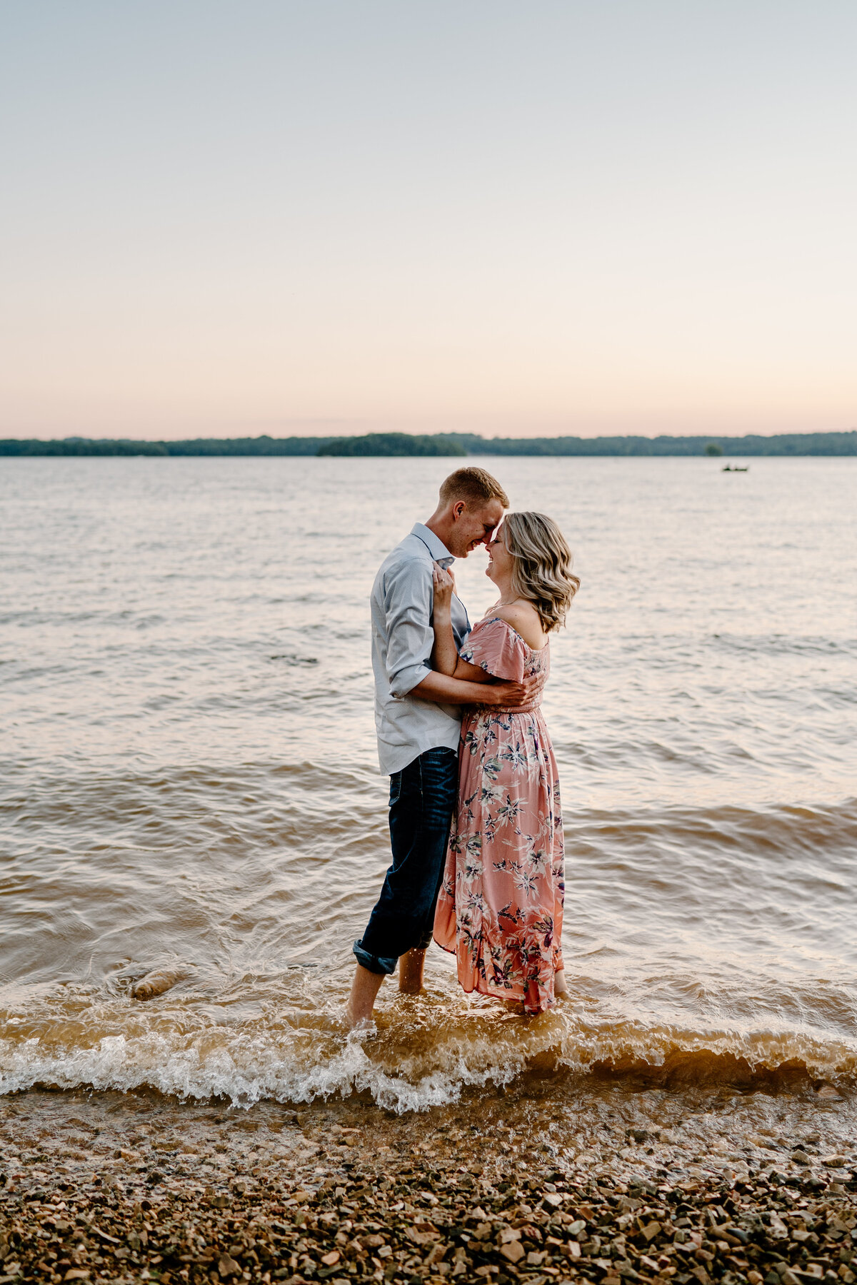 Couple standing in lake on the shore in Nashville, Tennessee