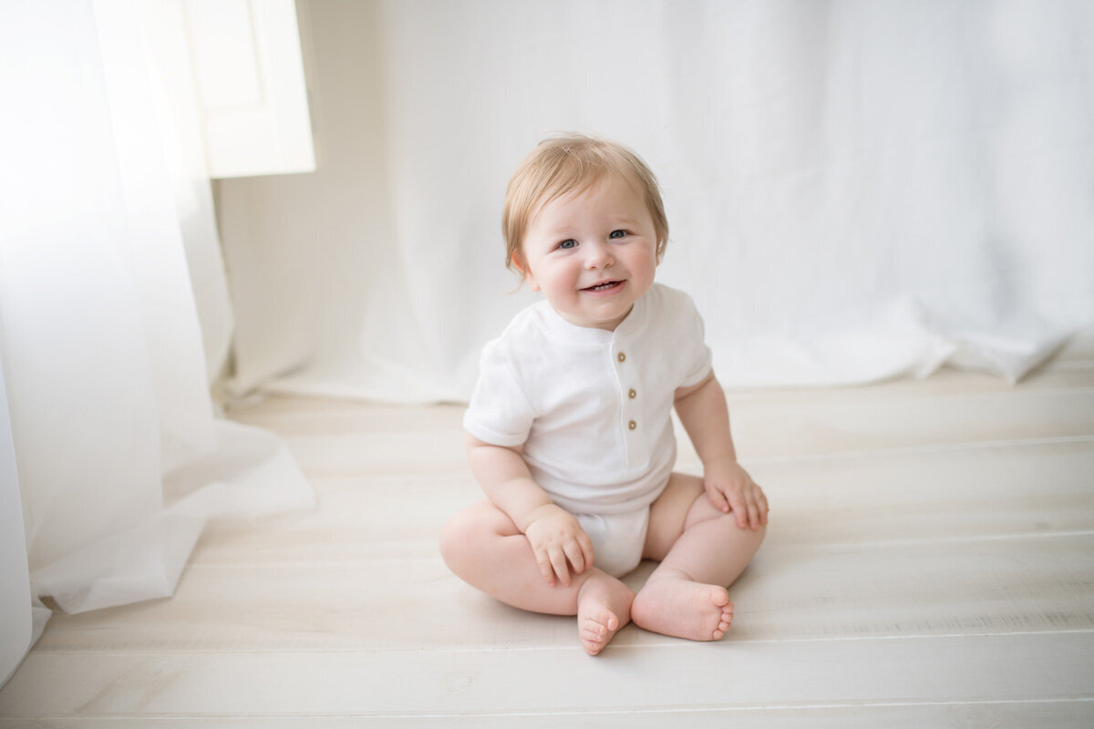 Family session of little boy sitting down