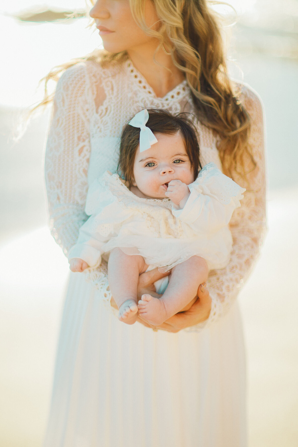 Family Portrait Photo Of Mother In White Dress Carrying Her Baby Los Angeles