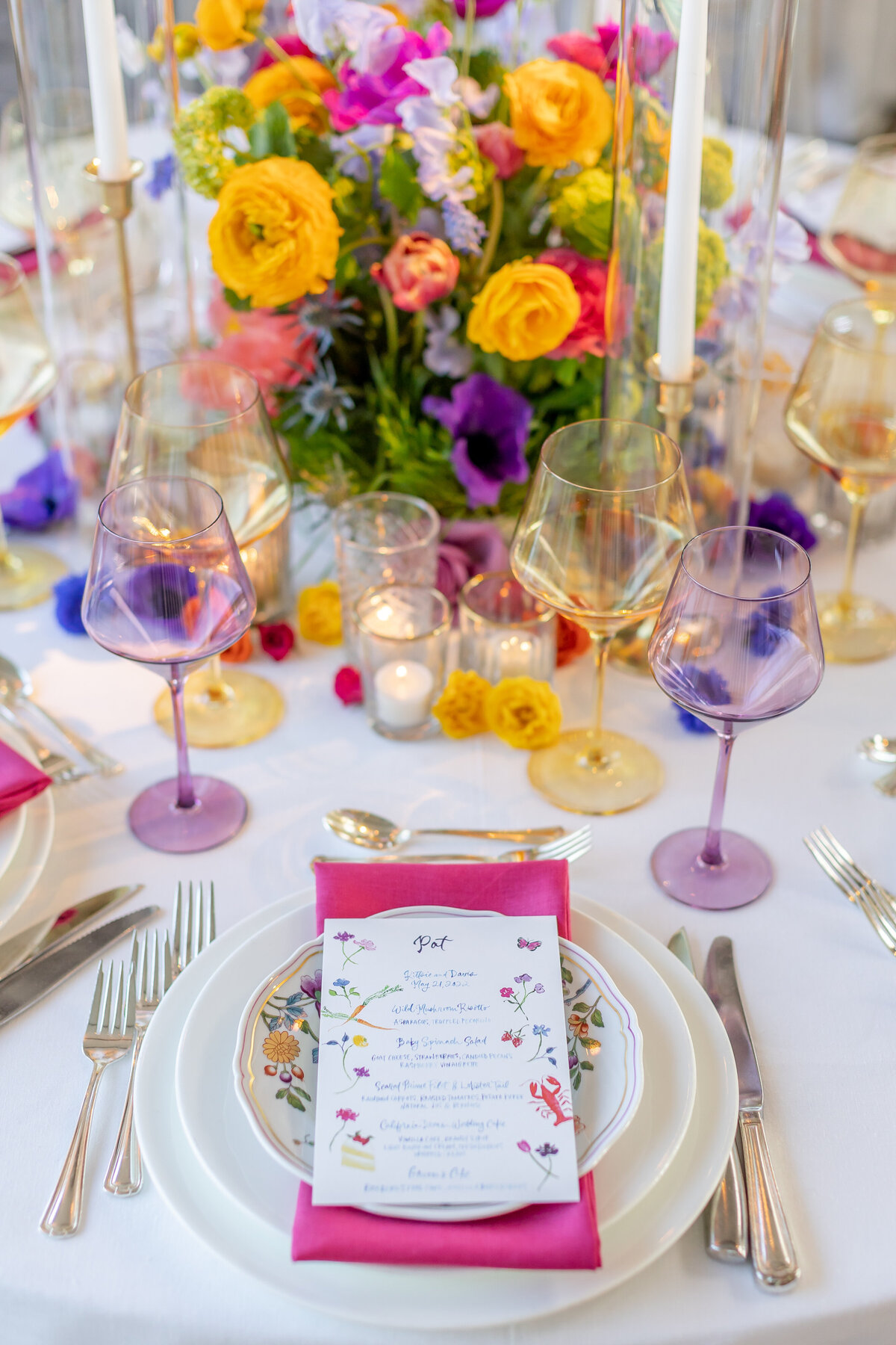 Colorful Menu, glassware,and flowers