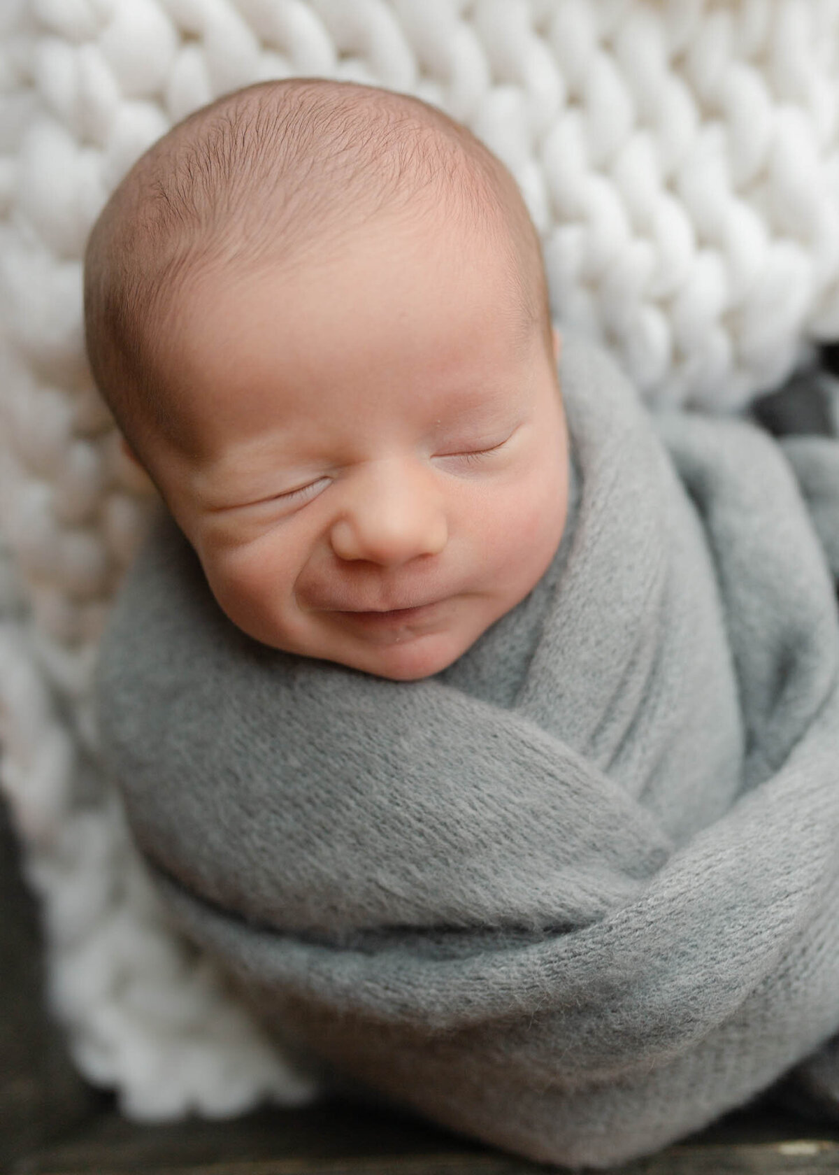 newborn baby winking