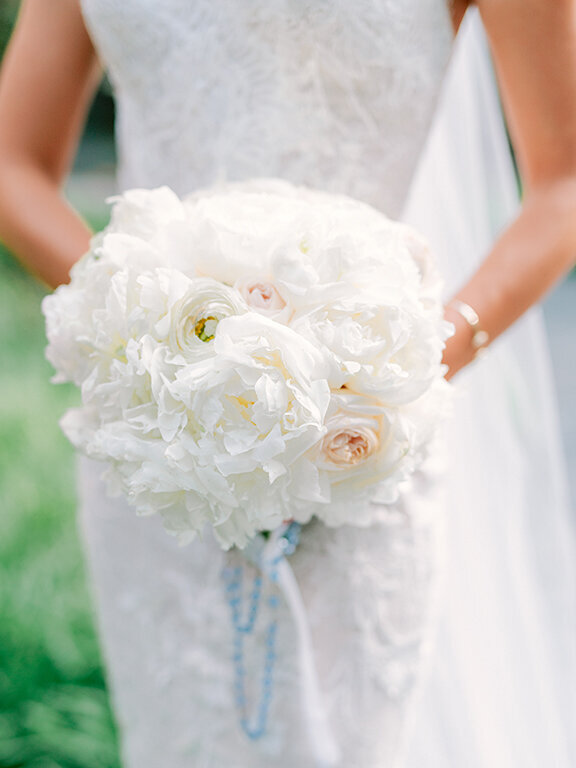 Bride holding bouquet of white florals at  Hotel Crescent Court, Dallas wedding