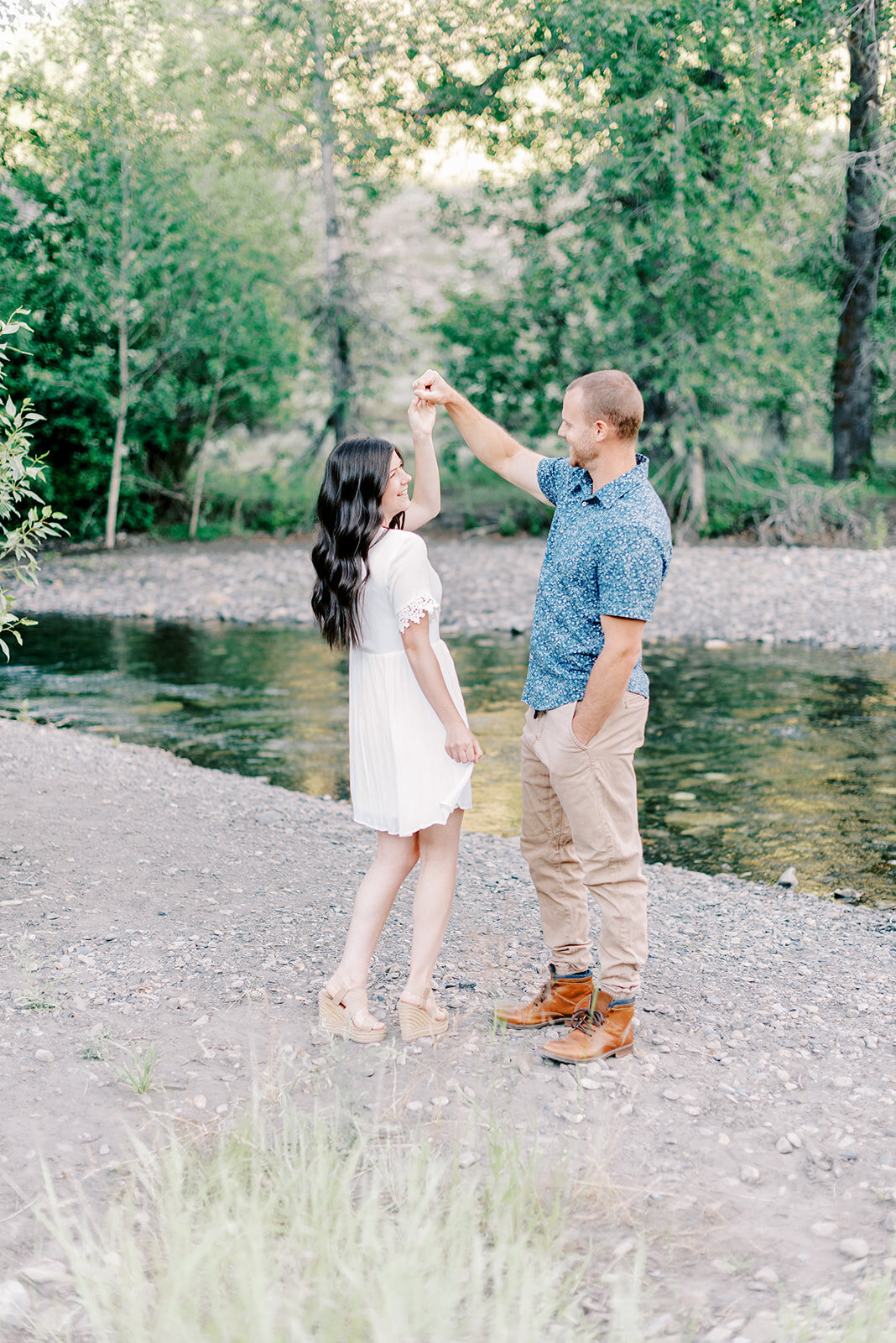 Couple twirling at Sun Valley Engagement Session with the Best Sun Valley Wedding Photographers