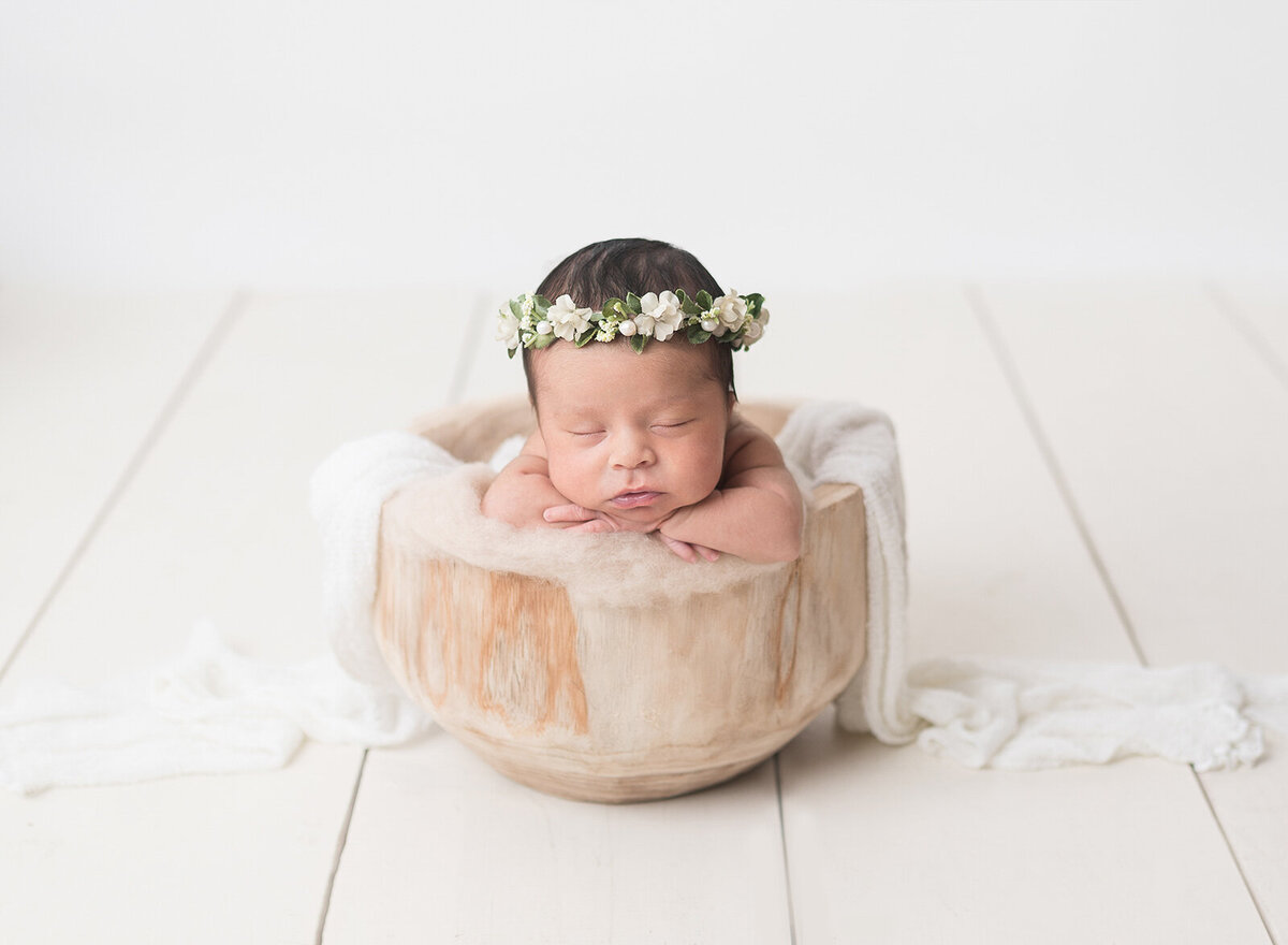 Creative newborn Photoshoot  with flower Headdress by Houston photographer