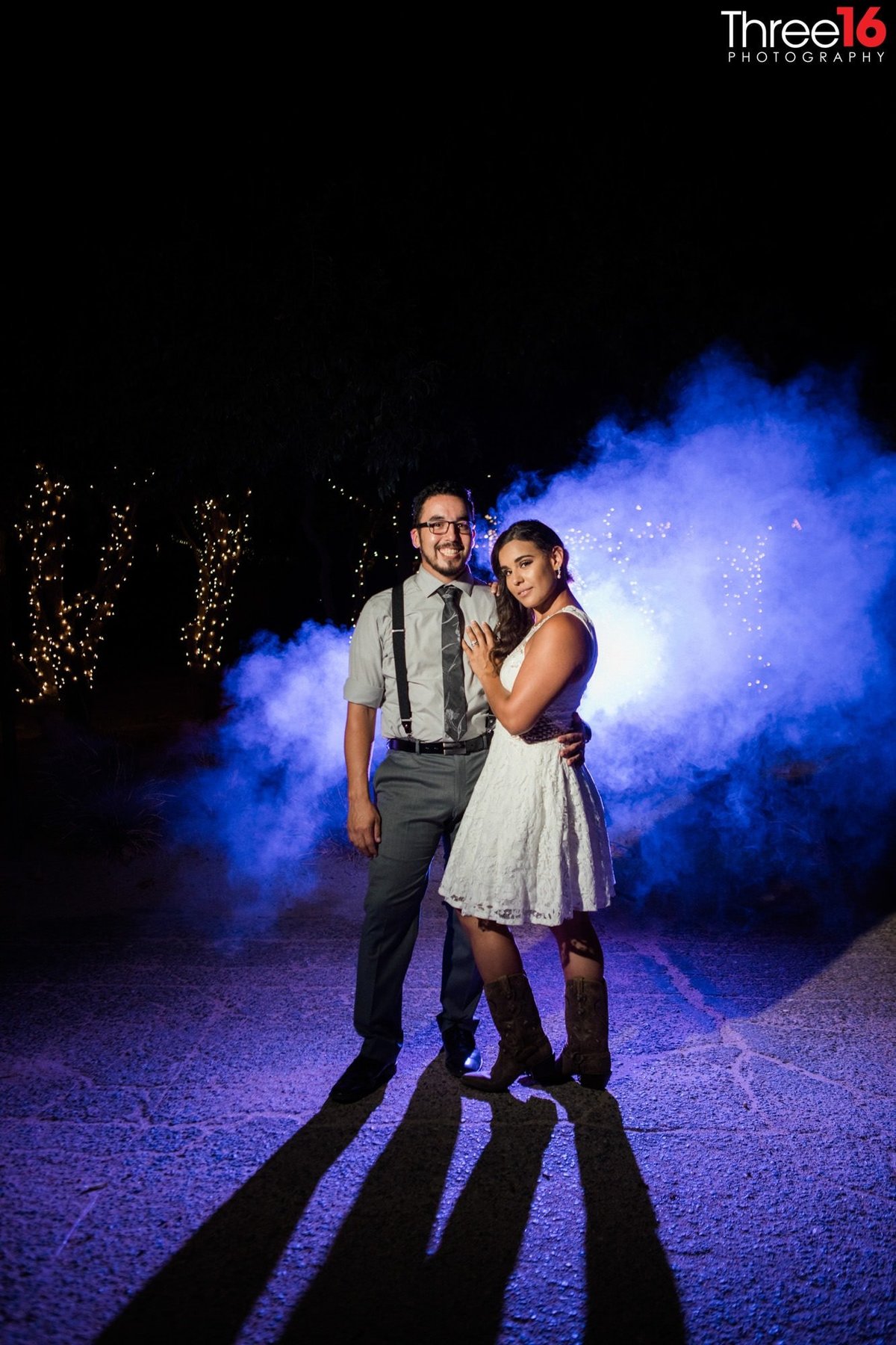 Night shot of couple with blue background