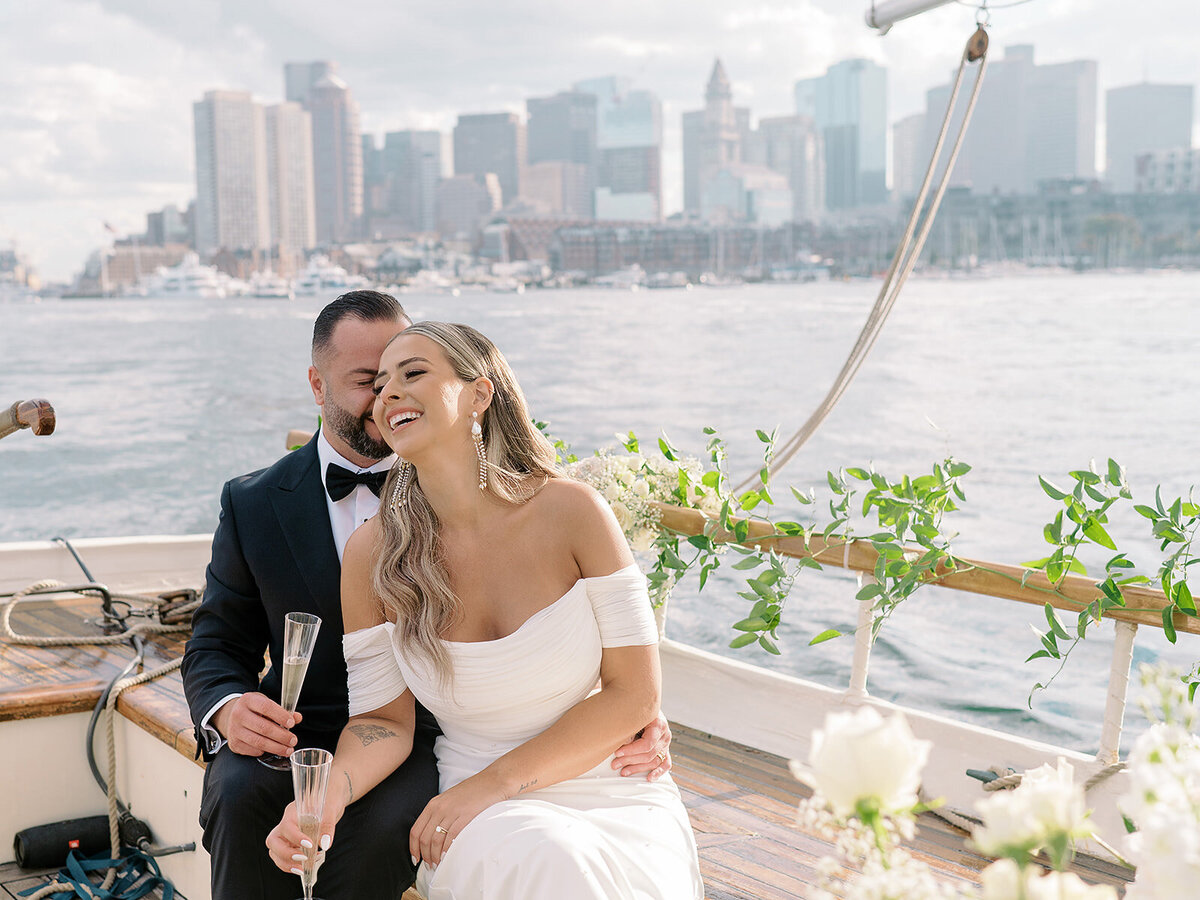 Kate-Murtaugh-Events-sail-boat-yacht-elopement-wedding-planner-Boston-Harbor-skyline-MA