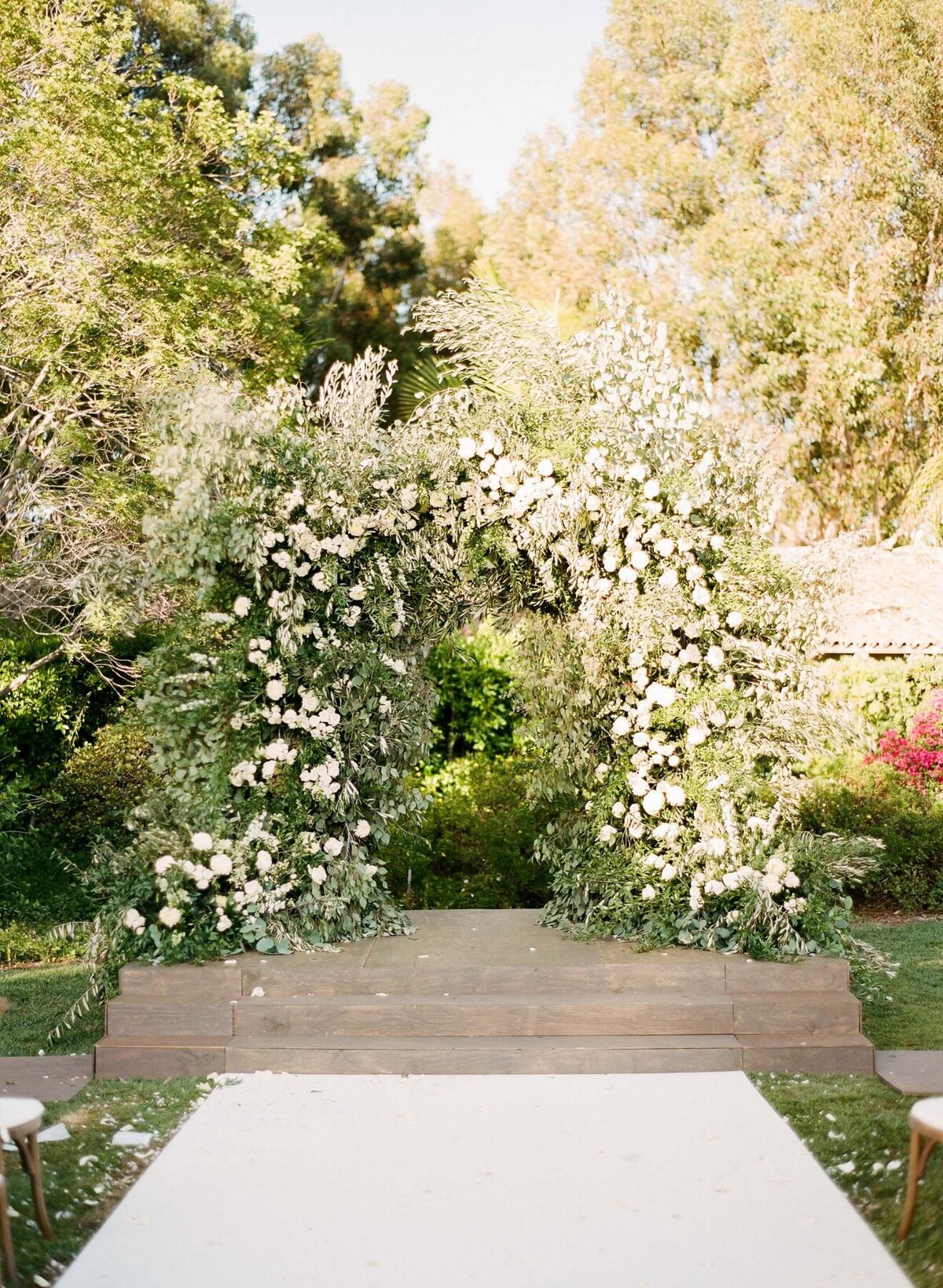 Huge plant archway with white flowers