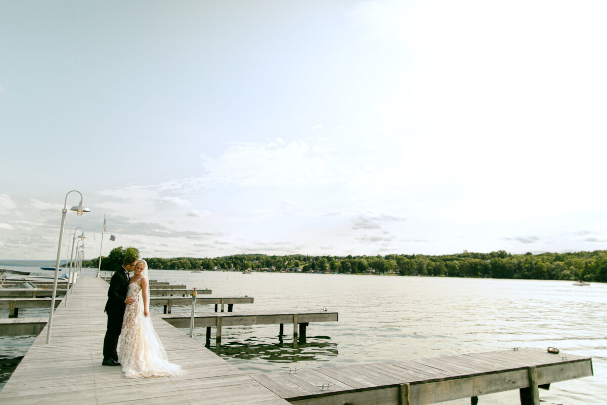 The Lake House on Canandaigua Wedding_Bride and Groom on Dock Photos_Verve Event Co (6)