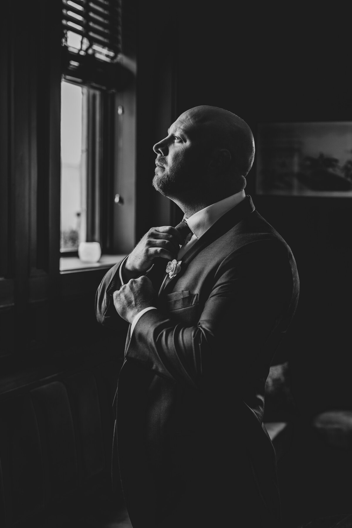 Groom checking out his neck tie just before the ceremony at The Monarch Club in Detroit.