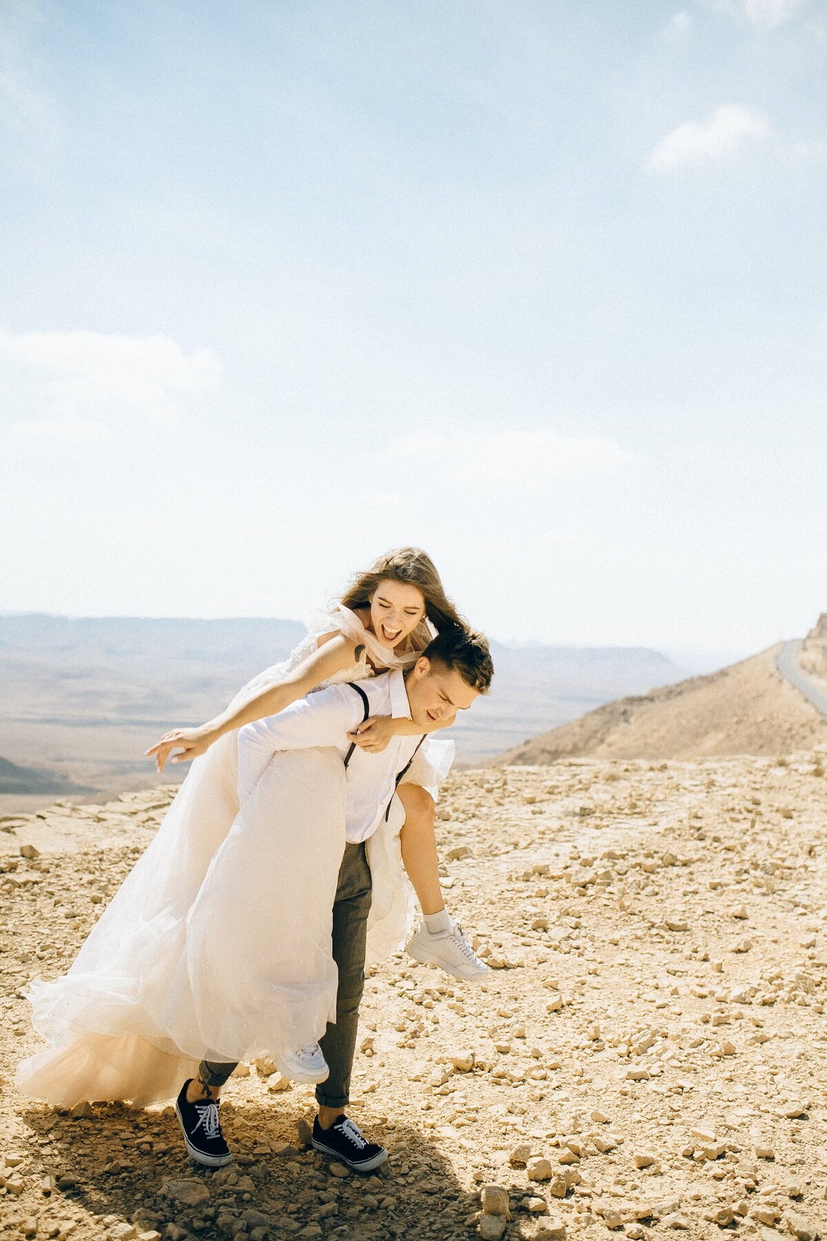 groom-carrying-bride