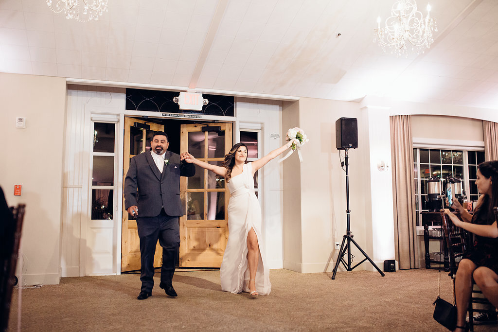 Wedding Photograph Of Groomsman And Bridesmaid Raising Her Hands Los Angeles