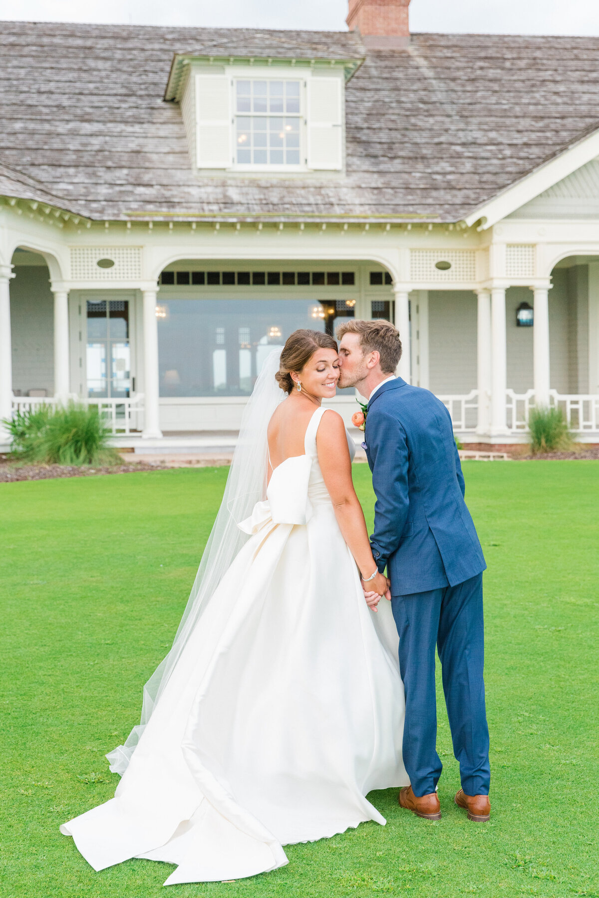 Couple pose at their Kiawah Island wedding at the Ocean Course