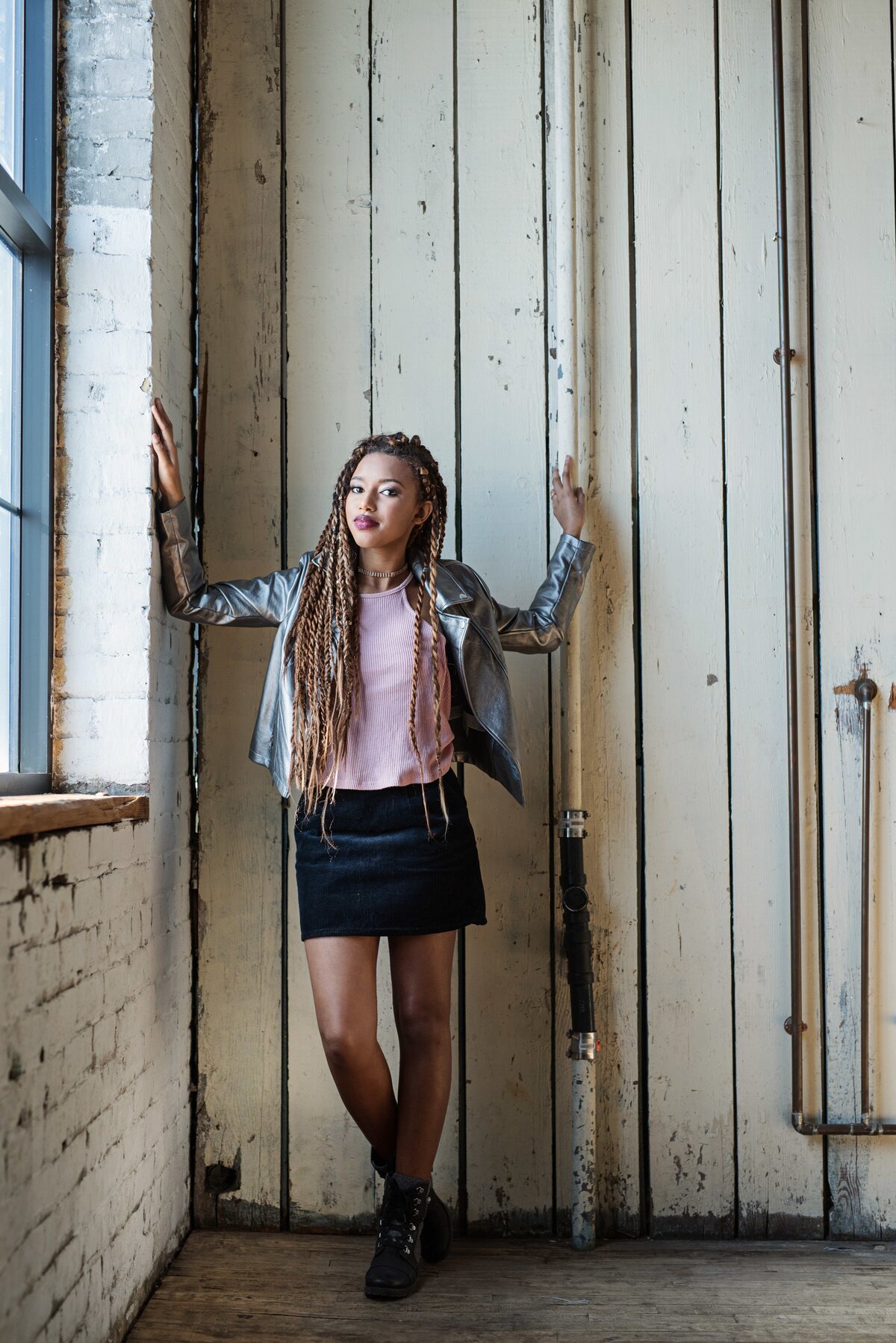 Woodbury High School  senior photo of girl in urban studio with fashion outfit