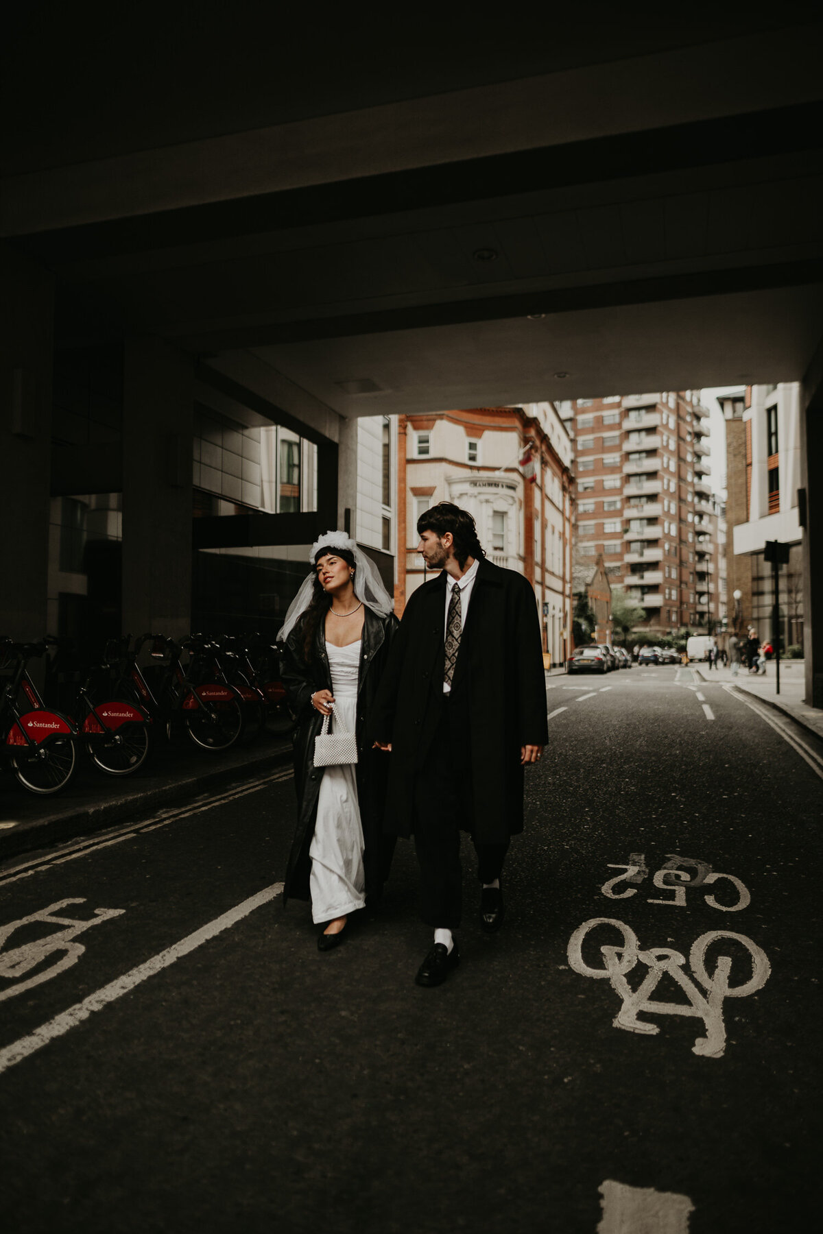 Stylish London Wedding couple walking through Hoxton.