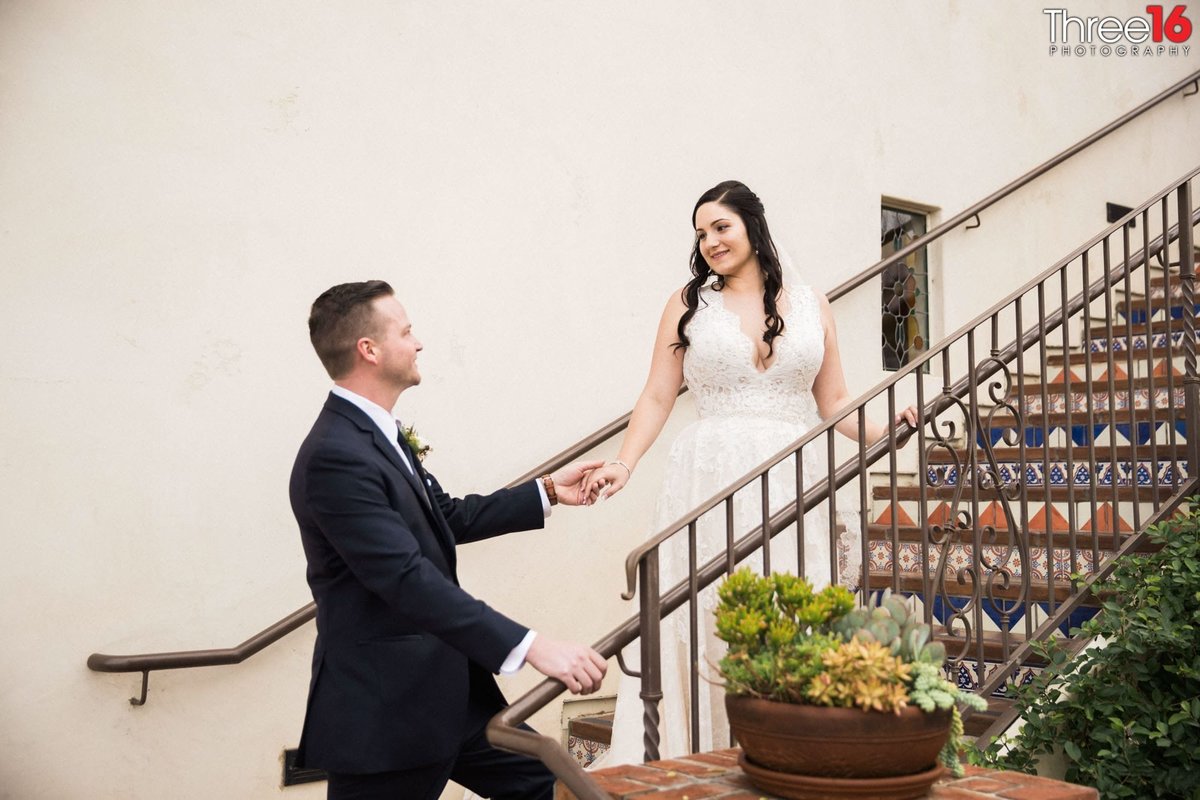 Groom addresses his Bride on the stairwell