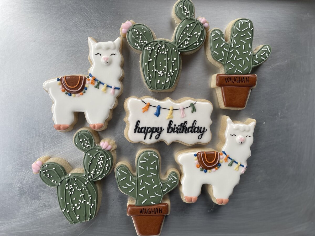 Custom-designed llama cactus sugar cookies with intricate icing details, perfect for birthdays, made in Gilbert.