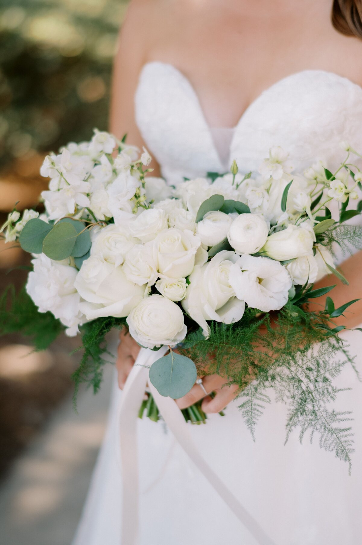 A closer look at the bride's white bouquet of florals.