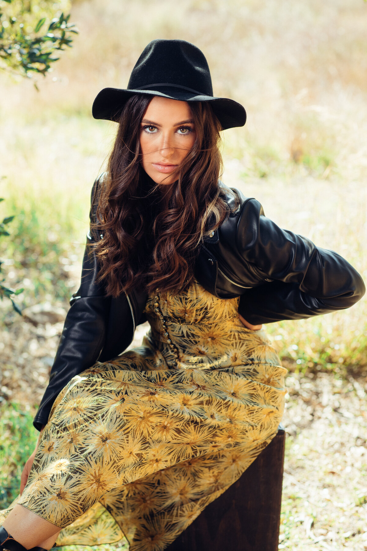 Portrait Photo Of Young Woman In Outer Black Leather jacket And Inner Yellow Dress Los Angeles