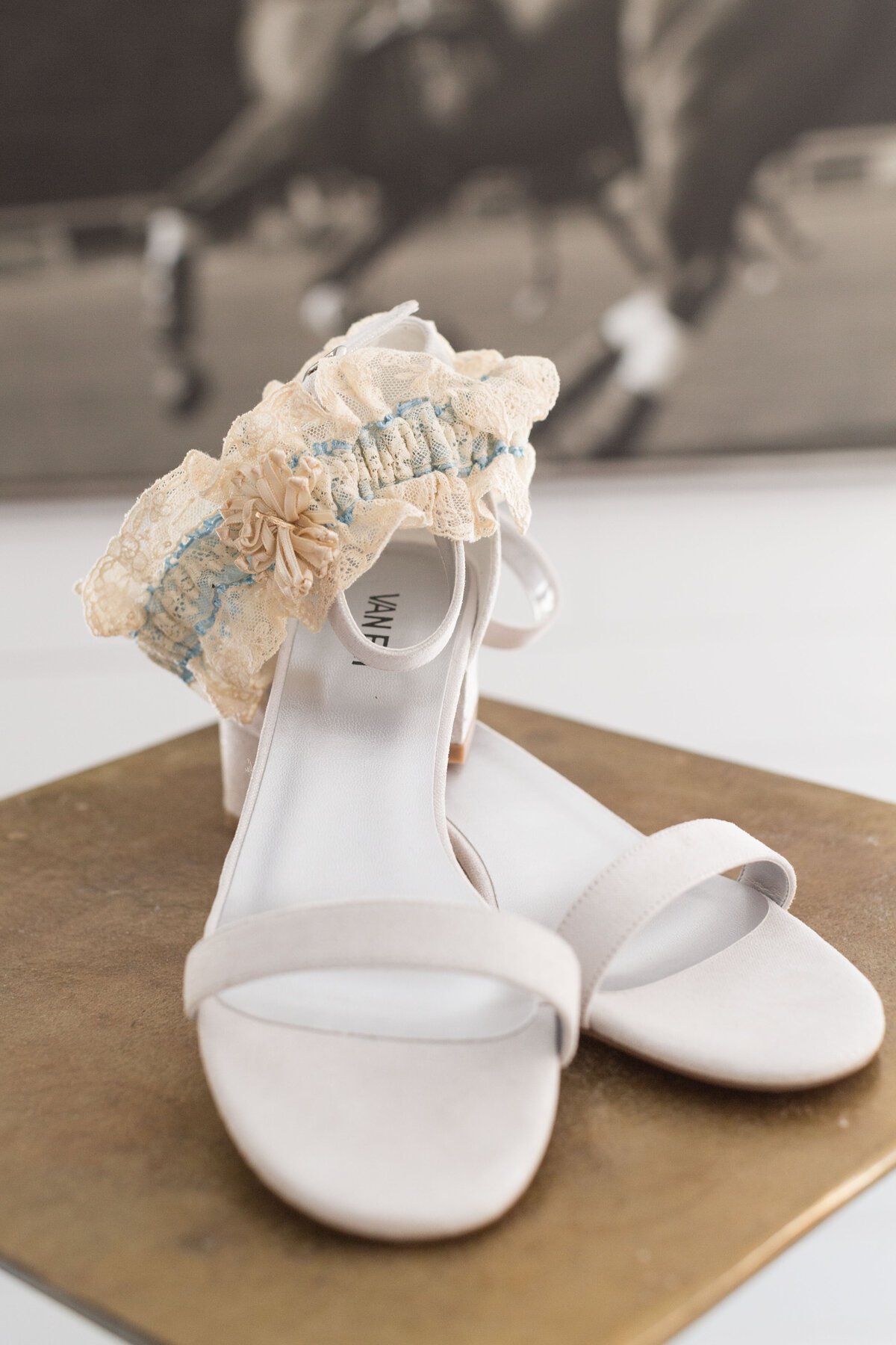 Detail photo of the brides shoes and garter to be worn on her wedding day.