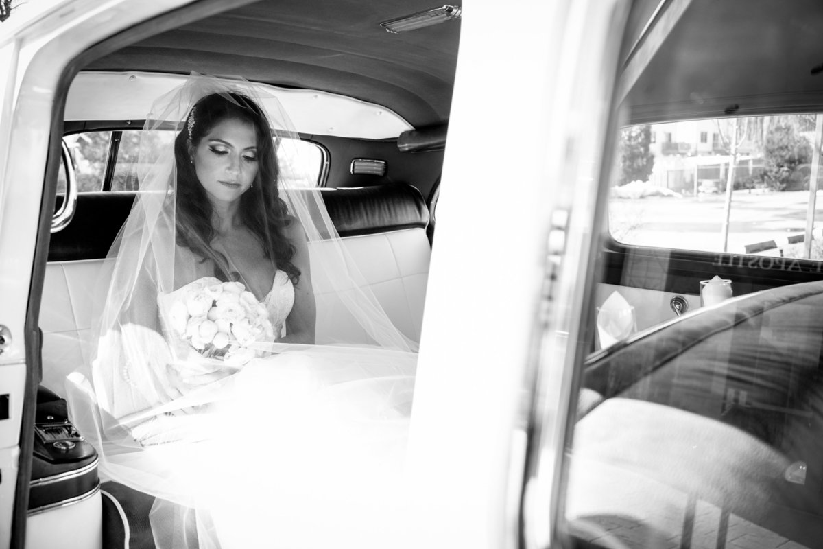 bride in rolls royce before wedding ceremony