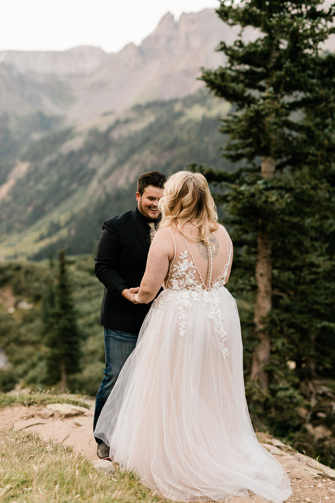 Ouray elopement couple hold hands