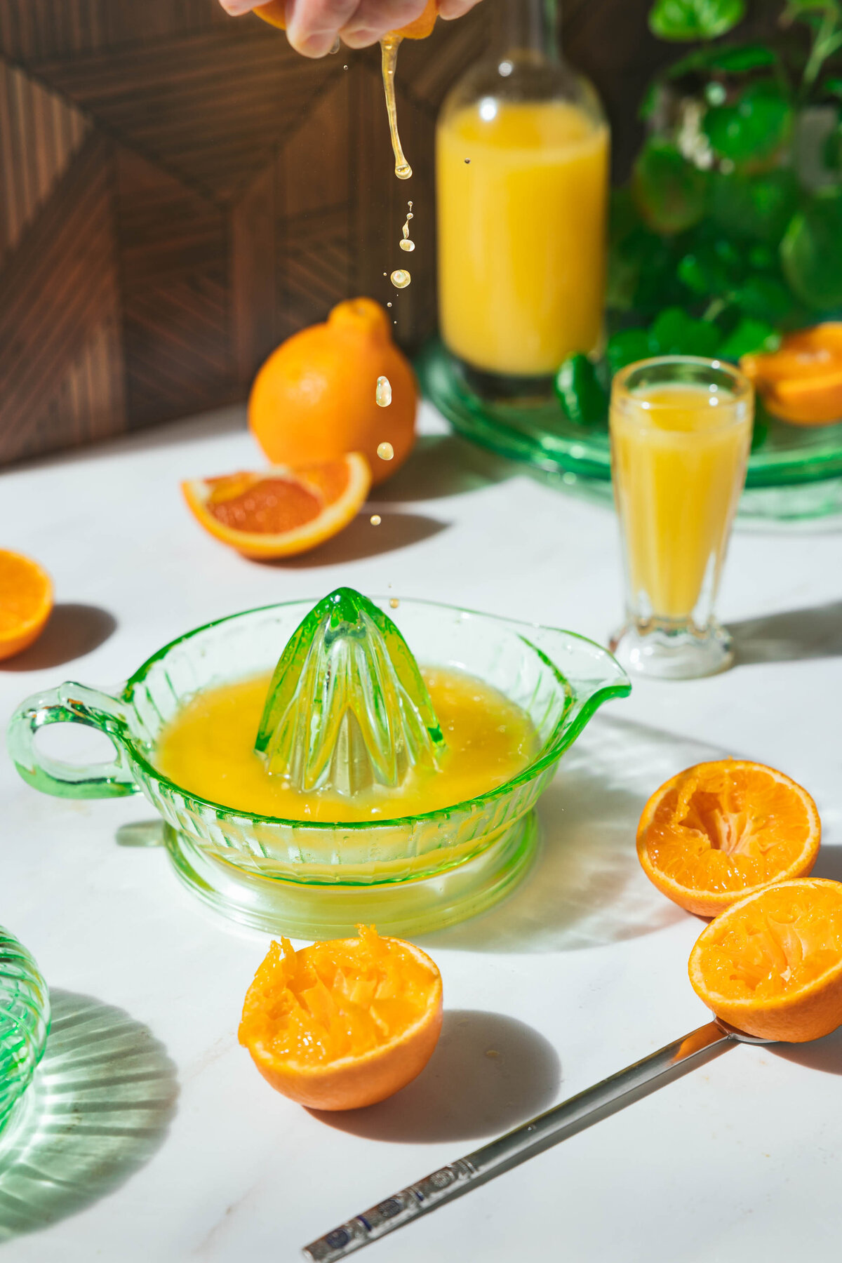 Organic orange being squeezed into fresh juice.
