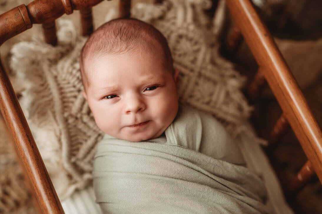 Baby posed for Newborn Photoshoot in Asheville, NC.