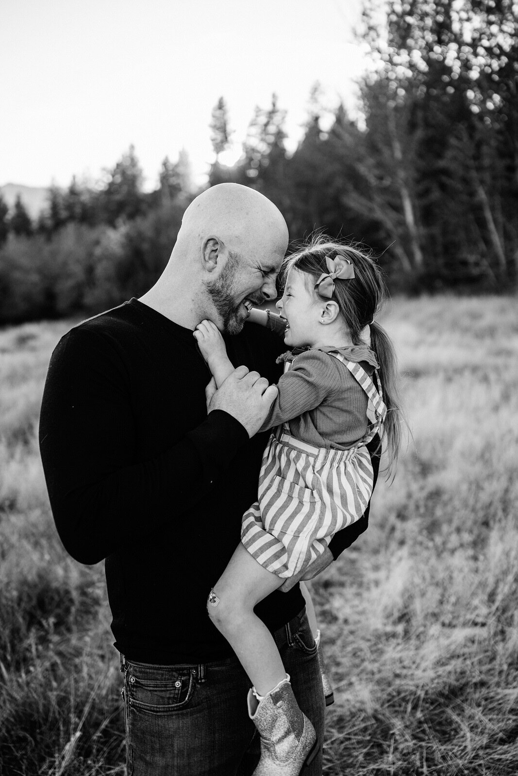 Dad holding daughter with love