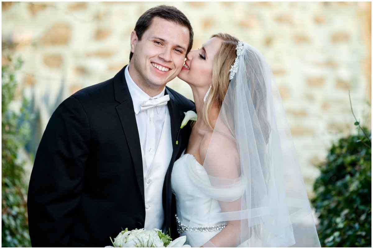 austin wedding photographer vintage villas bride kissing groom 4209 Eck Ln, Austin, TX 78734
