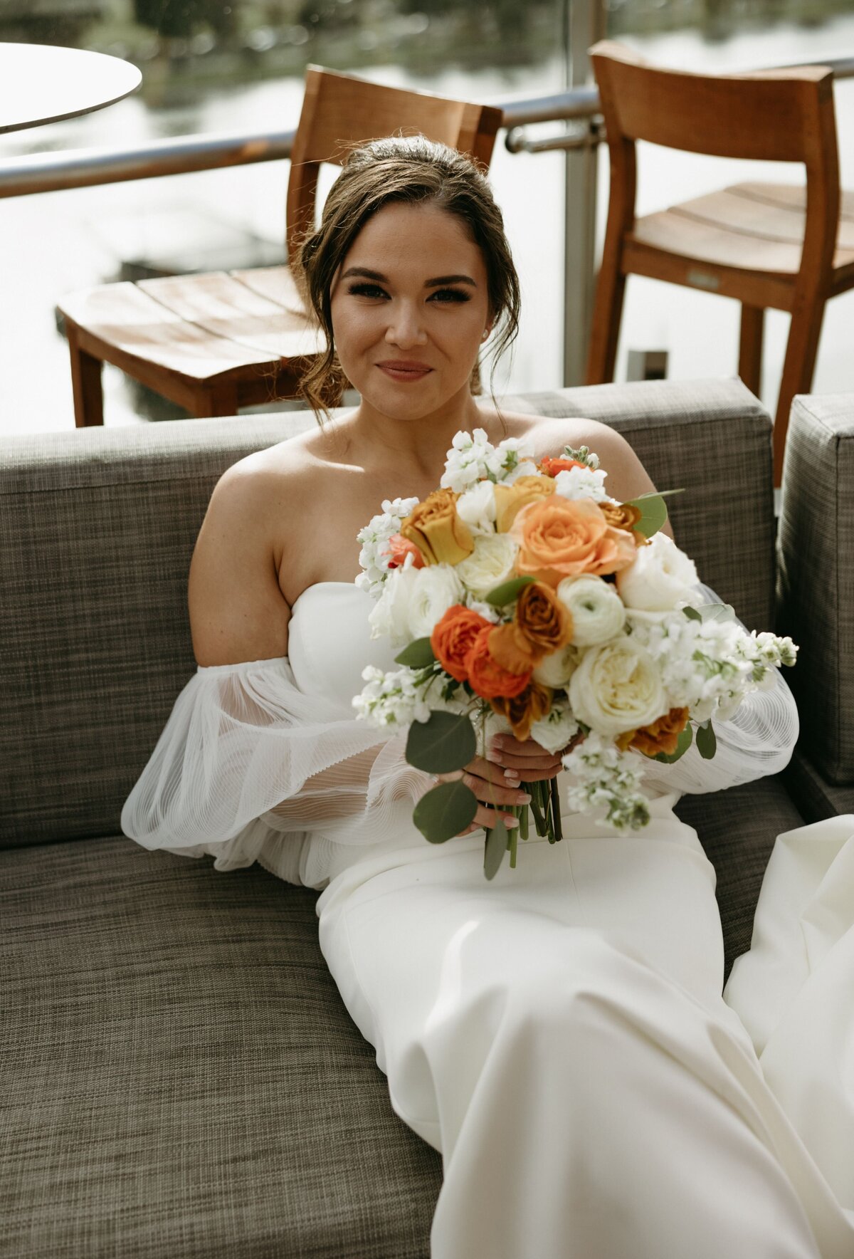 Event-Planning-DC-Washington-DC-wedding-Intercontinental-Wharf-Lexi-Truesdale-bride-bouquet-outside-seated