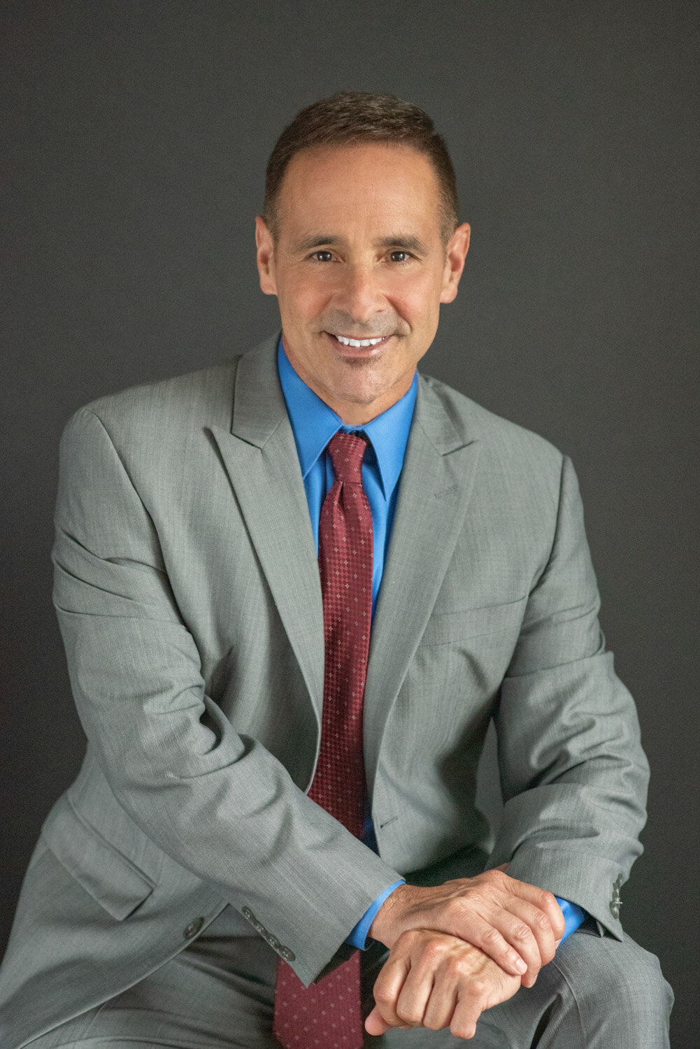Studio headshot of smiling professional in Orlando - Khim Higgins Photography