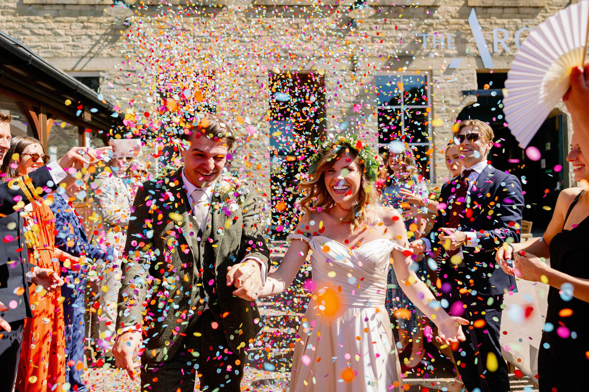Bride and groom enjoying confetti walk at The Arches, Halifax