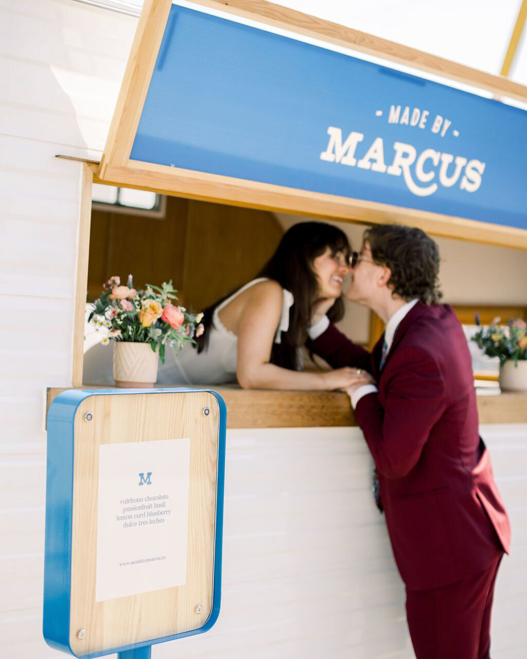 Bride and groom at a mobile ice cream trailer from Made By Marcus, unique and playful ice cream based in Calgary, AB. Featured on the Brontë Bride Vendor Guide.